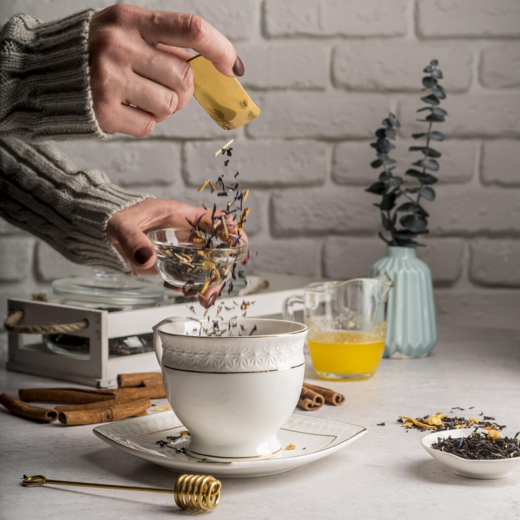 pouring tea herbs